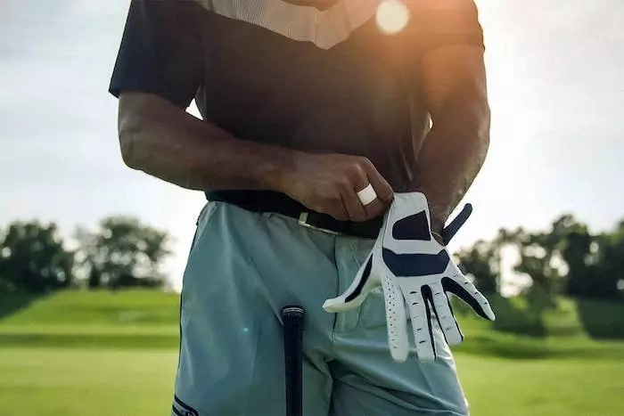 Golf Glove with Magnetic Golf Ball Marker with White Golf Glove While golfer wears them on course