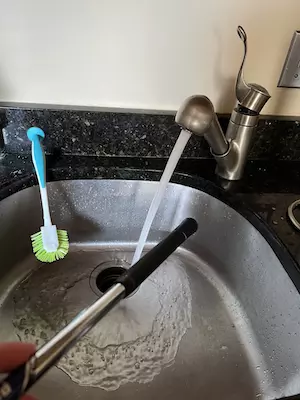 Take the soft bristle brush and go up and down the shaft with a medium level scrub to get the grime out; conduct 2-3 upward and downward strokes max