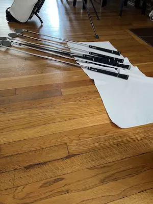 Set the club on the towel and let air dry for 4-24 hours (depending on outside air temperature