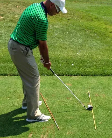  While the backswing is just as important as the downswing, your feet position should be closed resulting in your shoulders and club path feeling like you’re aiming way left (for right handed golfers).
<p>Ultimately, you should notice that your downswing cuts across your body and golf ball.</p>
<p>As you might imagine, the club path drives much of the curve of the ball. Your grip also plays an important part, but you’ll be able to increase the severity of your fade solely based on your club path.</p> 