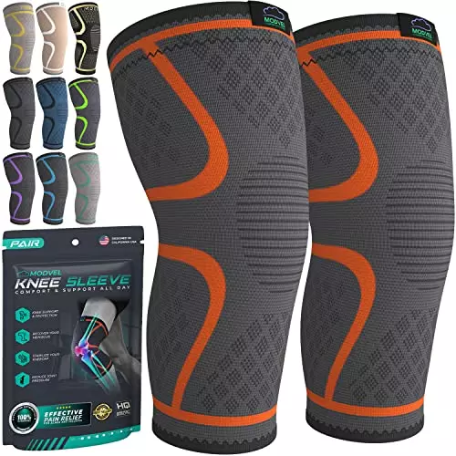 The Modvel Knee Braces for Knee Pain Women & Men - 2 Pack is a gray with orange outline knee brace sleeve that covers the top and bottom of the knee with great compression, fit, and warmth